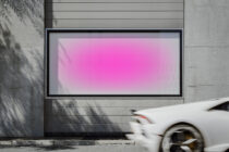 Horizontal digital billboard with pink gradient glow on urban concrete facade