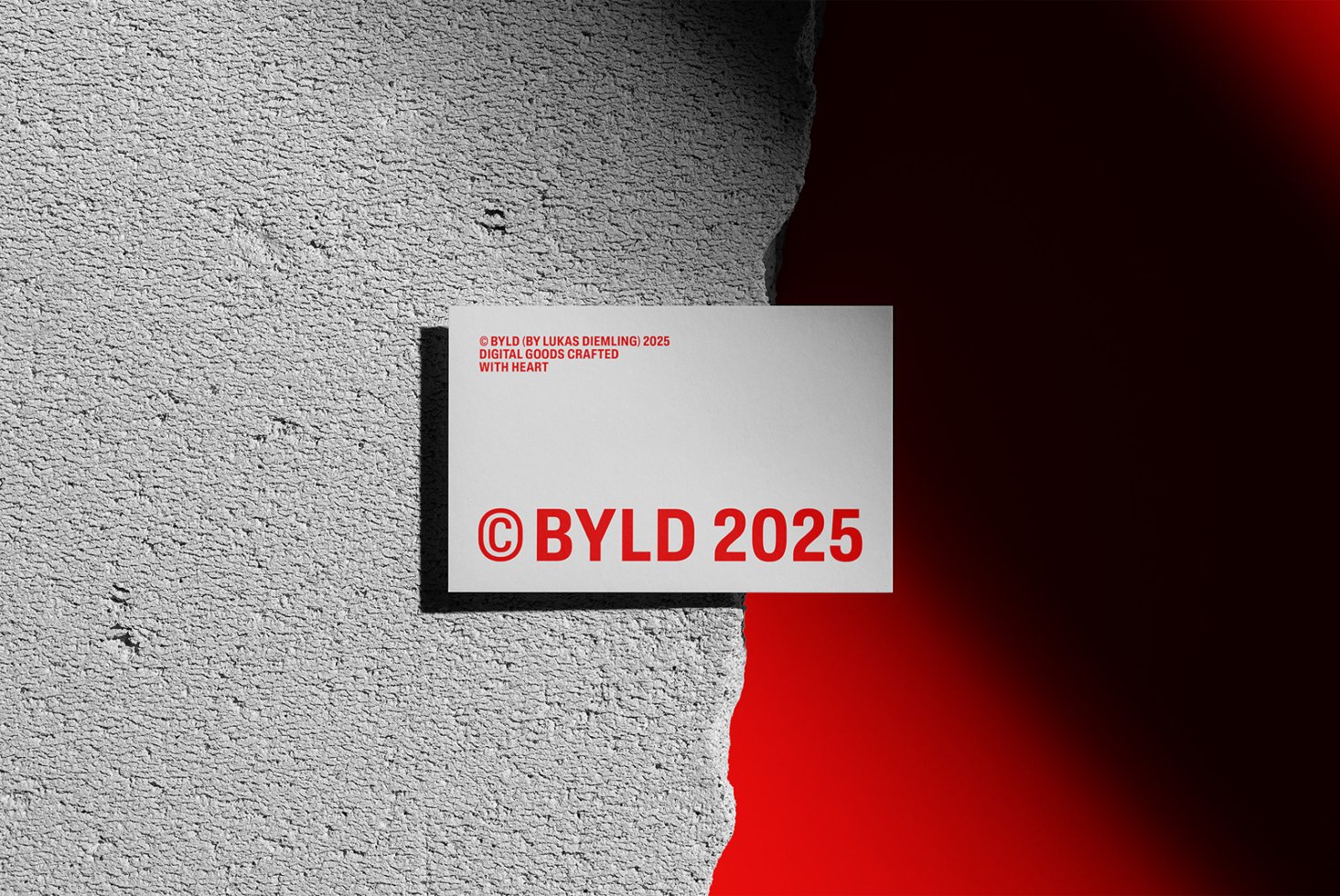 Business card mockup on textured surface with bold red text BYLD 2025. Perfect for designers seeking unique identity graphics and branding templates.