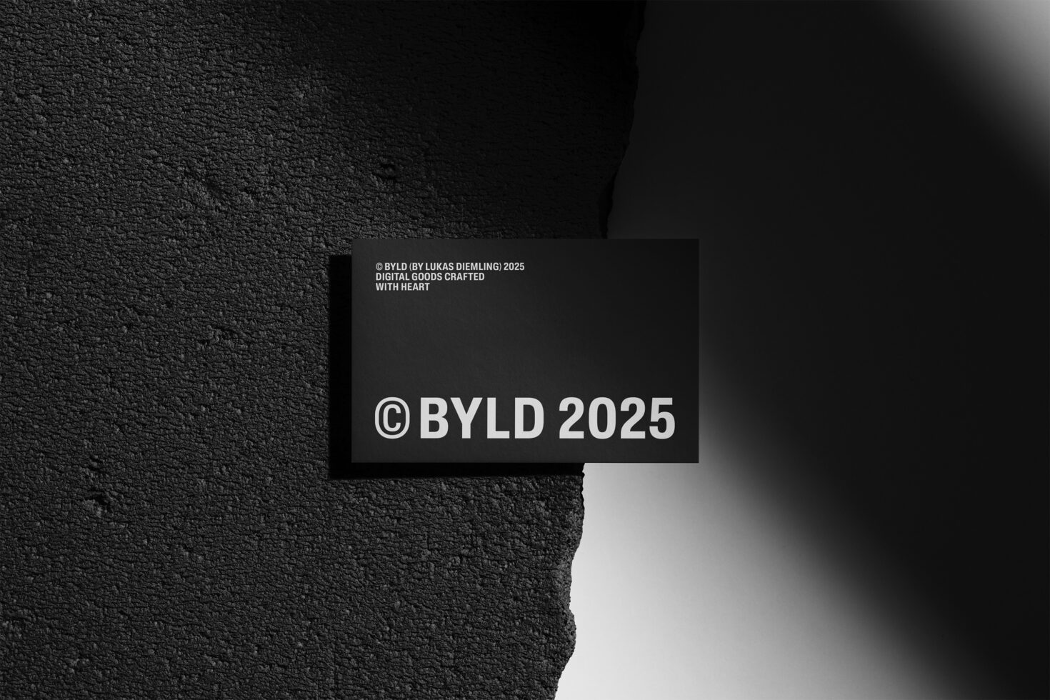 Dark textured business card mockup with BYLD 2025 text on torn background. Ideal for branding presentations graphic design and marketing templates.