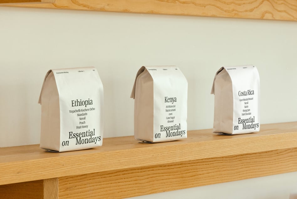 Three coffee bags in cream, bright lime, blue lined up showing Ethiopia Kenya Costa Rica labels