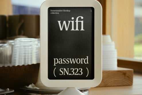 Mockup of digital display showcasing WiFi password in a modern cafe setting. Ideal for designers seeking cafe-themed graphics and templates.