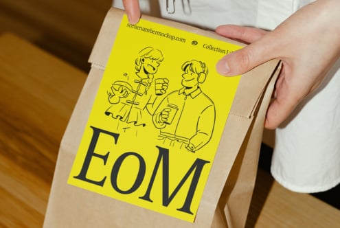 Yellow paper bag mockup with cartoon illustration and EoM text, perfect for designers asset marketplace, packaging template, branding visualization.