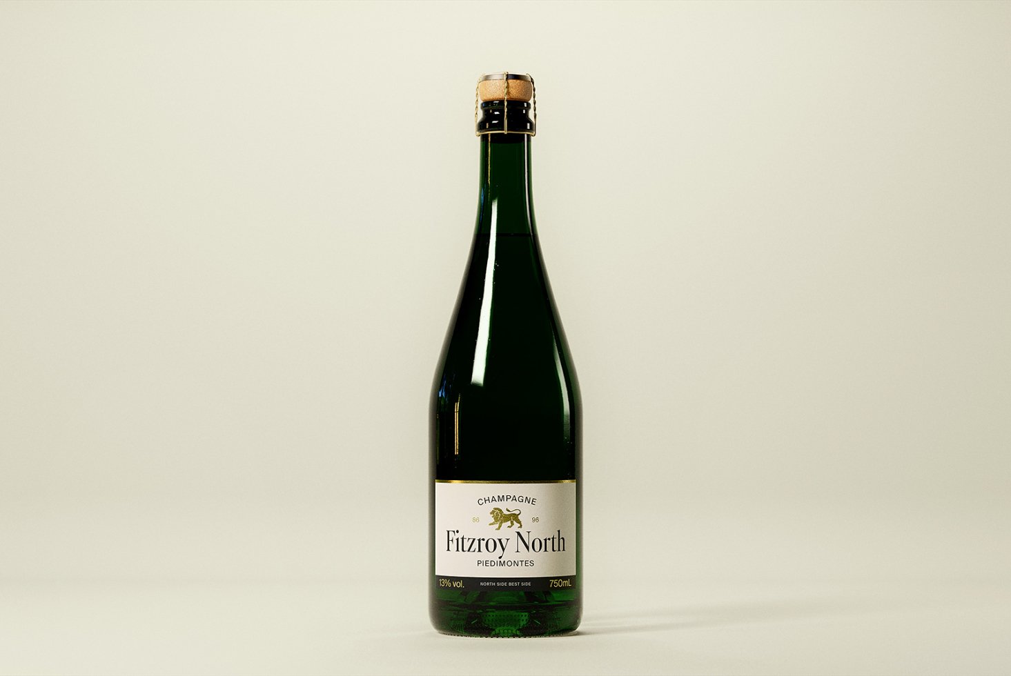 Elegant champagne bottle mockup with green glass highlighting wine label design. Perfect for product presentation and branding projects.