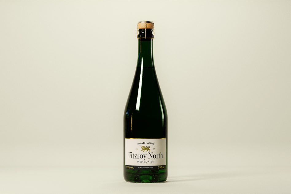Sparkling wine bottle mockup with dark green glass, cream background