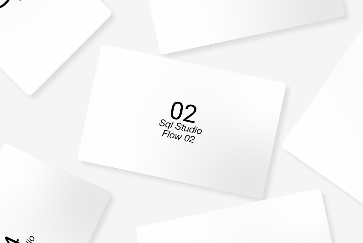 Set of overlapping business card mockups on a white background featuring minimal design and black typography ideal for graphic designers and branding.