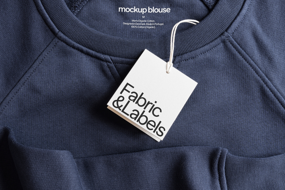 Navy crewneck sweatshirt with white hang tag label mockup detail shot