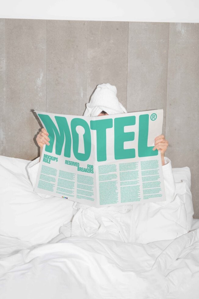 Person in bathrobe reading a large newspaper with the word Motel in bold. Perfect for designers seeking mockup inspiration, typography ideas.