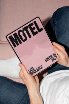 Pink motel door hanger mockup with check in 24/7 text