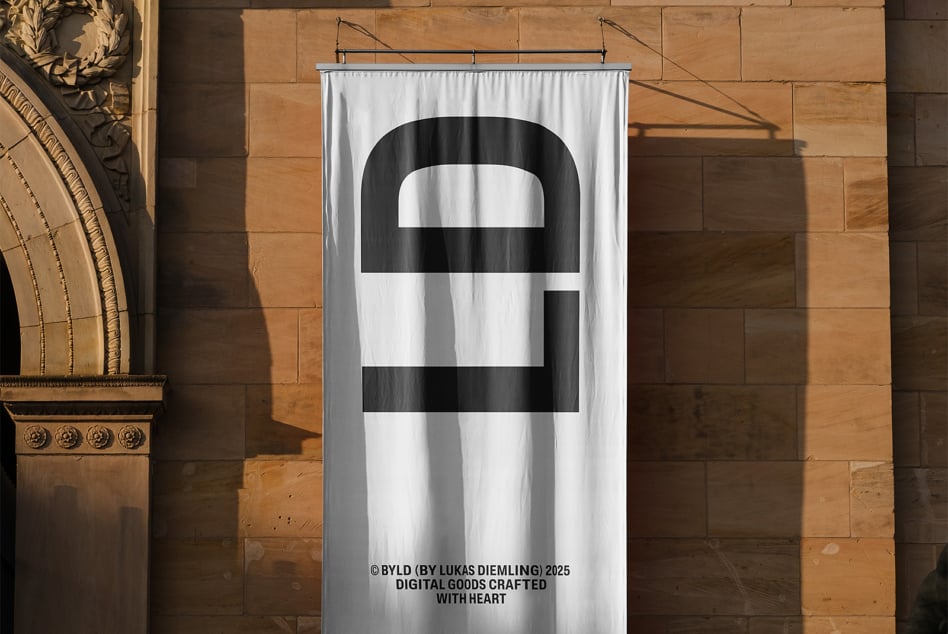 White fabric banner featuring black striped design mounted on sandstone facade