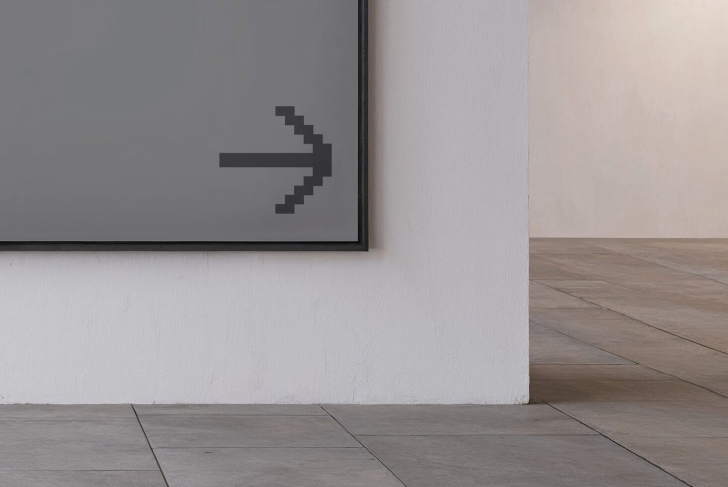 Mockup of a minimalist room interior featuring a large framed artwork with a pixelated arrow pointing right. Ideal for graphic design, template use.