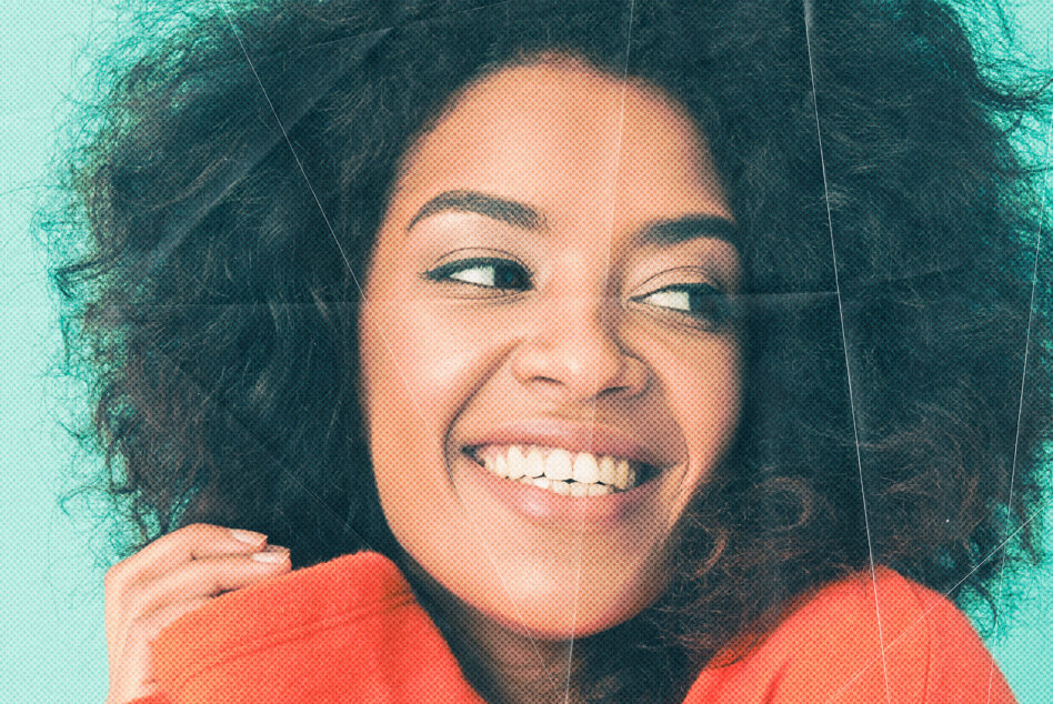 Smiling portrait with teal background, red shirt, halftone texture overlay