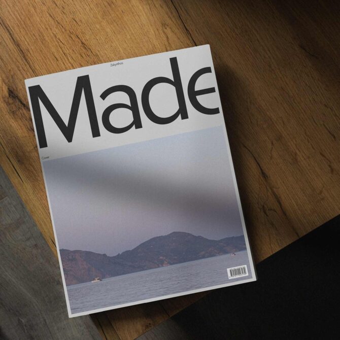 Magazine cover mockup on wooden surface with gradient blue photo below text