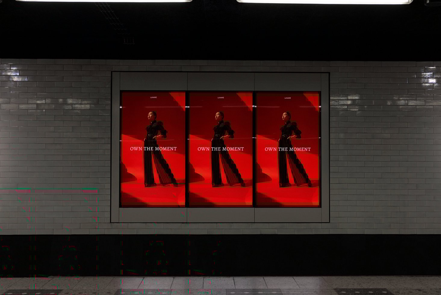 Subway advertisement mockup featuring a fashion model in black against a bold red backdrop. Ideal for designers seeking striking ad display templates.