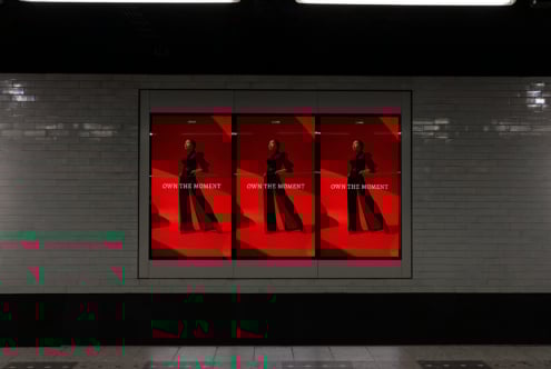Subway advertisement mockup featuring a fashion model in black against a bold red backdrop. Ideal for designers seeking striking ad display templates.