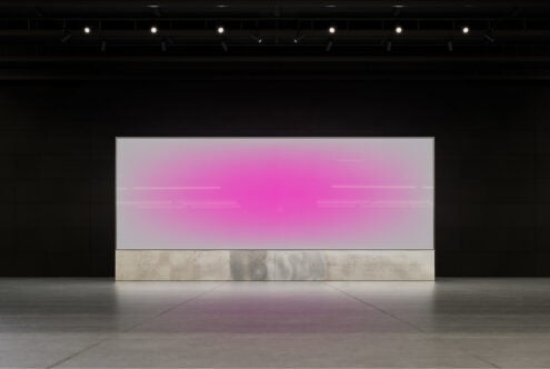 Minimalist mockup of an empty gallery space featuring a large rectangular panel with a vibrant pink gradient. Ideal for showcasing art designs templates.