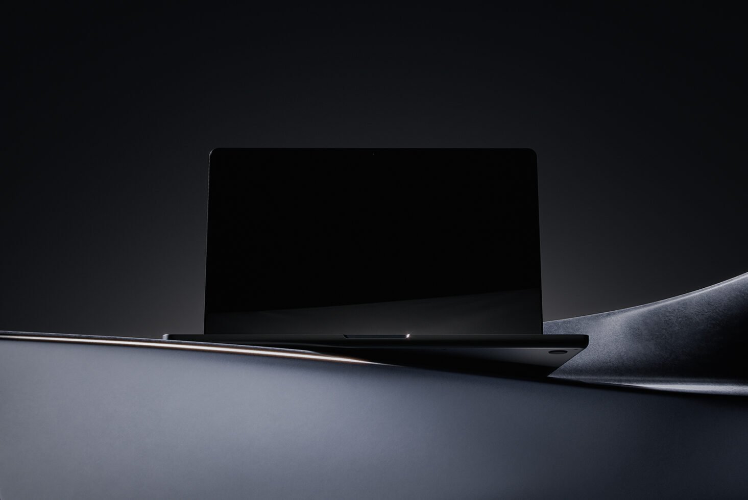 Minimalist laptop mockup in dark theme with sleek design perfect for showcasing digital assets or templates for designers tech graphics marketplace.