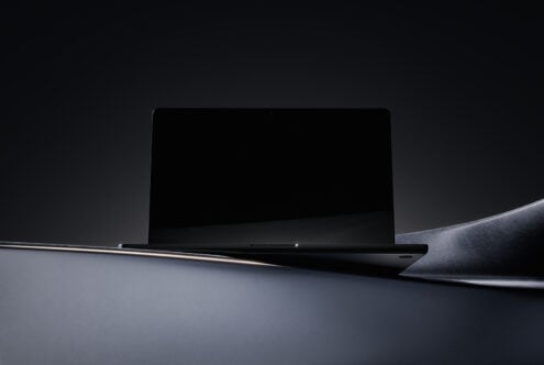 Minimalist laptop mockup in dark theme with sleek design perfect for showcasing digital assets or templates for designers tech graphics marketplace.