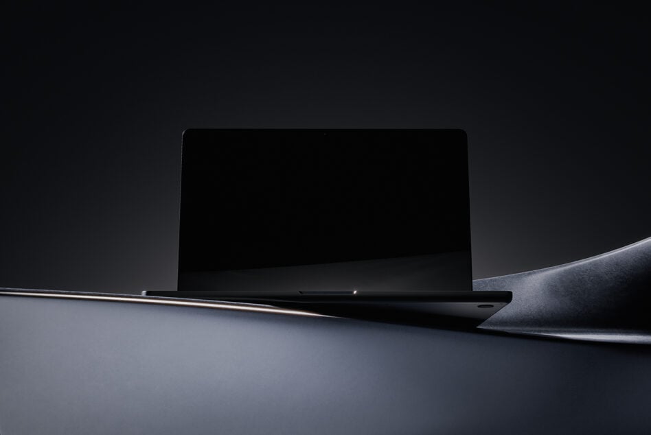 Minimalist laptop mockup in dark theme with sleek design perfect for showcasing digital assets or templates for designers tech graphics marketplace.