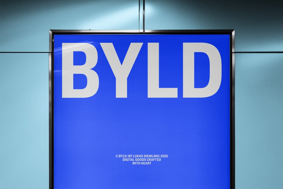 Large blue illuminated sign reading BYLD mounted on building against turquoise sky