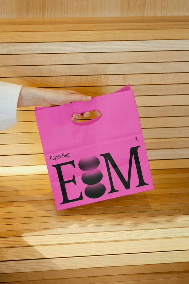 Vibrant pink paper bag mockup featuring bold typography ideal for showcasing branding design presentations or promotional materials.