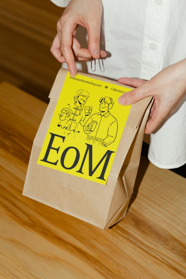 Brown paper bag mockup featuring bright yellow label, ideal for designers. Customizable template for branding, product packaging, graphic design.