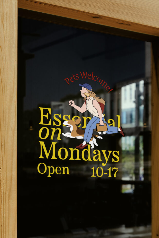 Storefront window mockup with colorful illustration of a woman walking a dog. Text reads Pets Welcome Essential on Mondays. Ideal for signage design.
