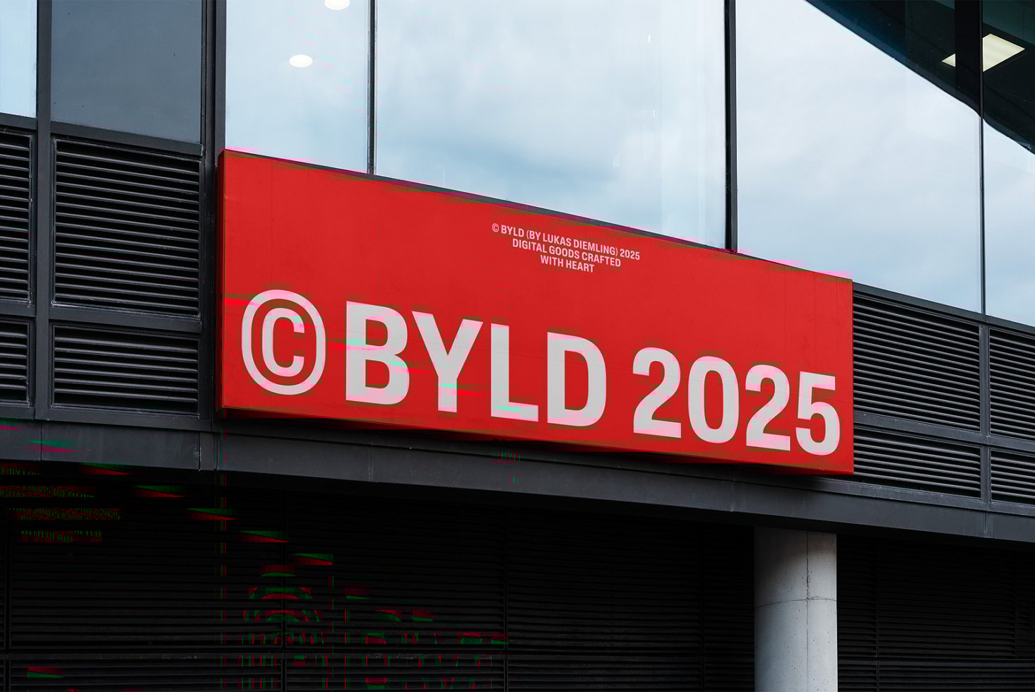 Red storefront sign with bold white text reading BYLD 2025. Modern font design ideal for mockups and branding templates. Urban display setting.