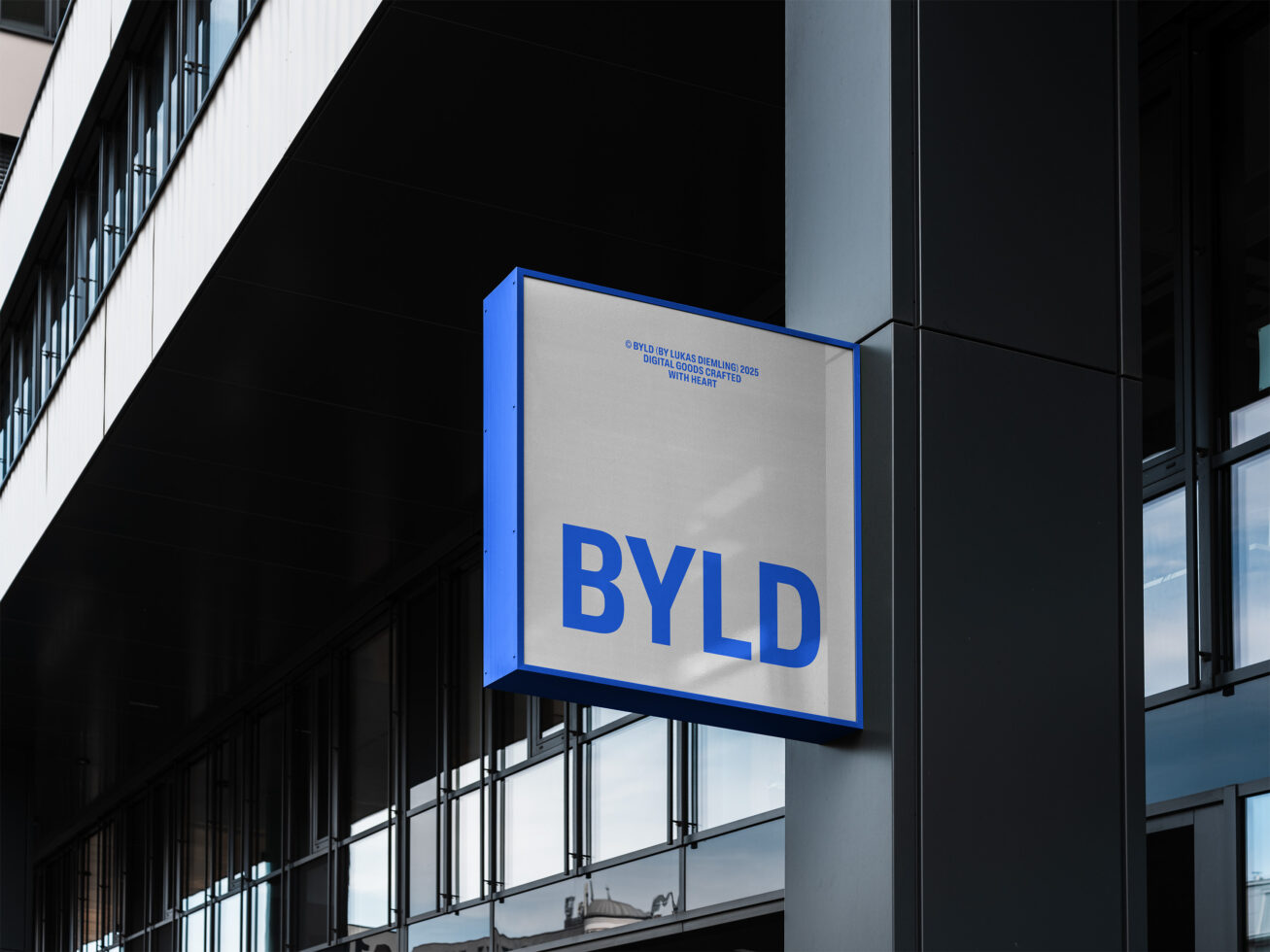 Urban building facade with a modern square sign displaying large blue text BYLD ideal for creating architectural mockups or graphic design visuals.
