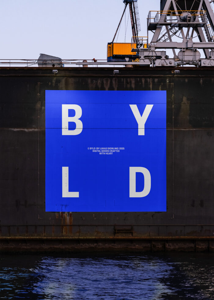 Blue and white typographic graphic reading BYLD on a ship's hull background suitable for mockups templates or graphic design projects.