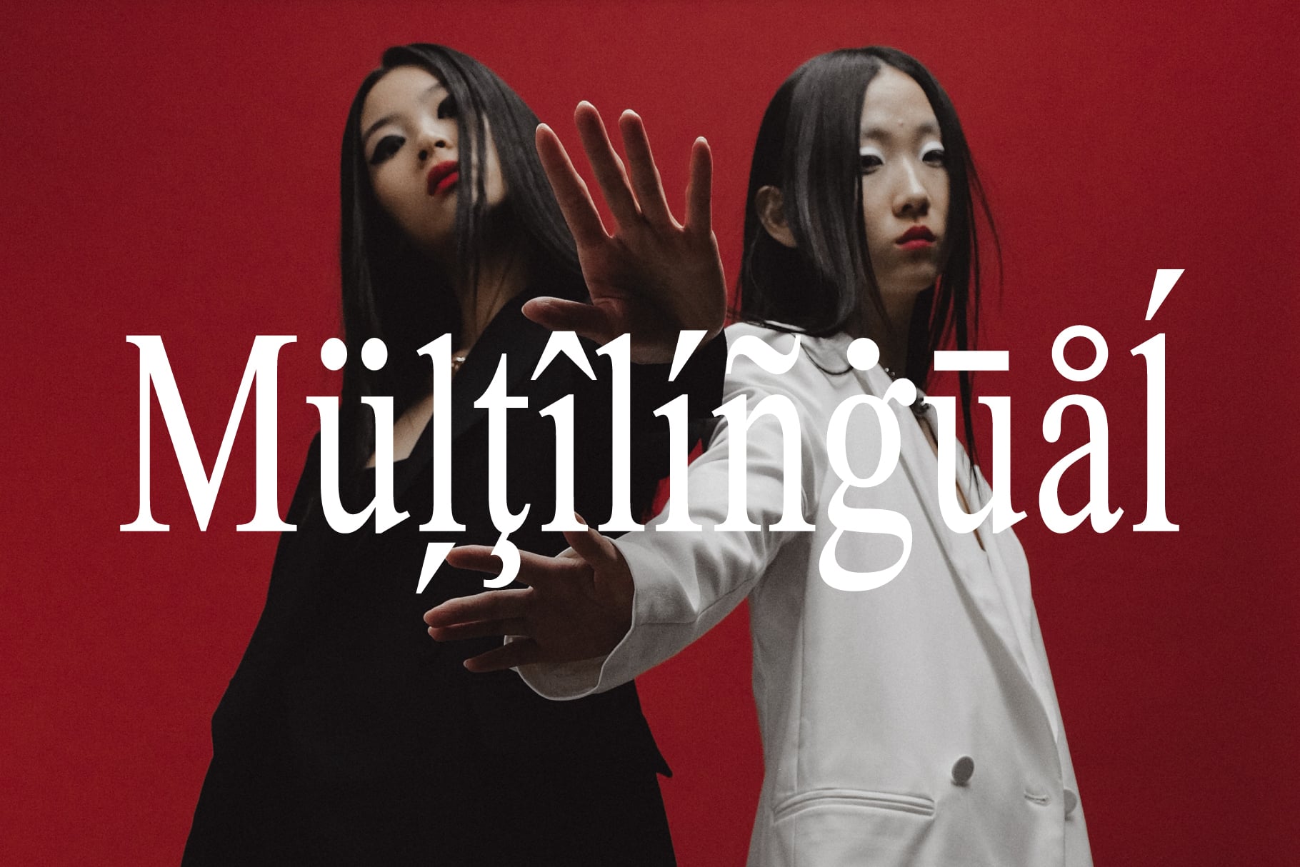 Two women on red background with overlapping hands showing Multilingual text overlay