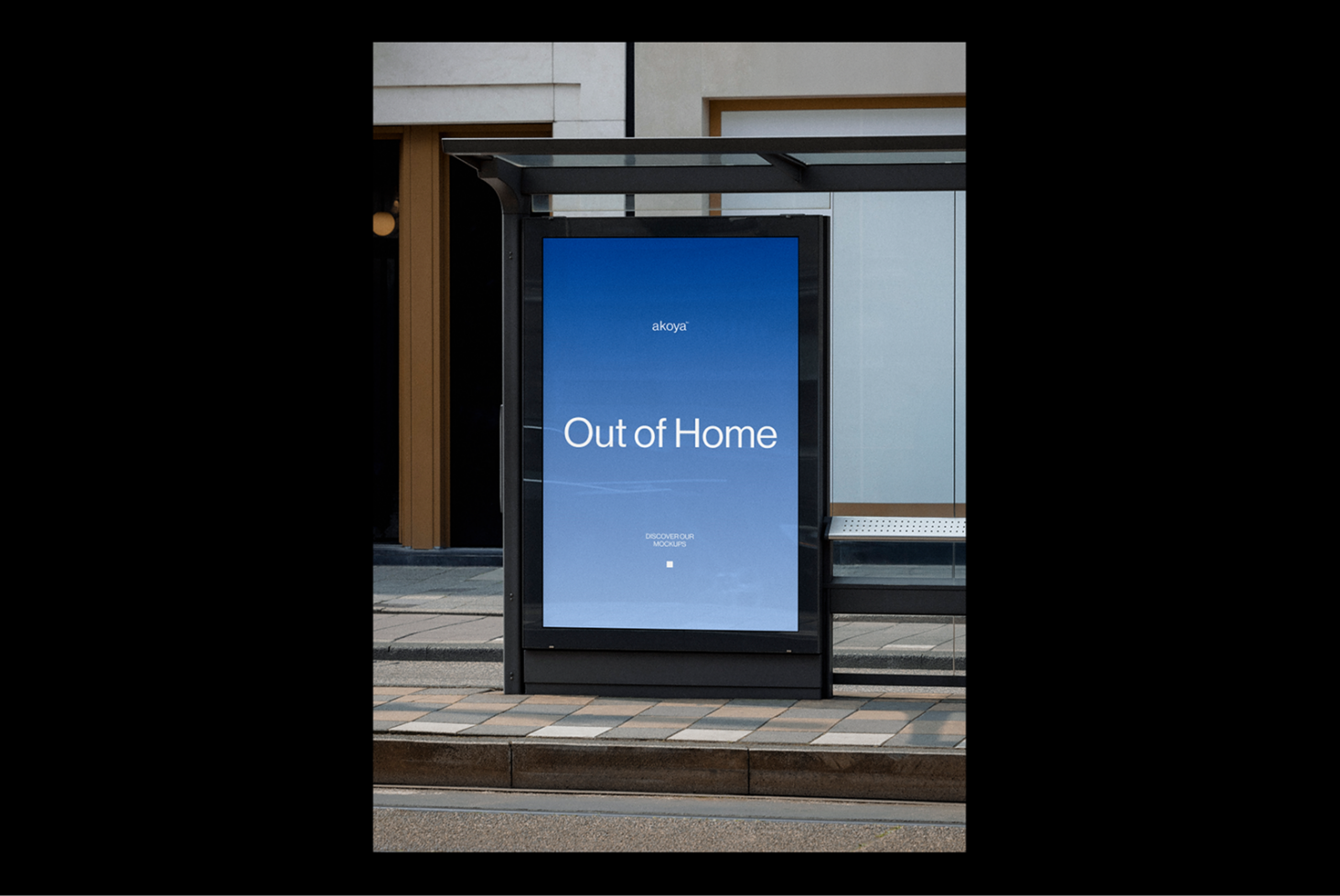 Bus shelter advertising mockup displaying Out of Home text on blue background. Perfect for designers looking for urban ad presentation templates.