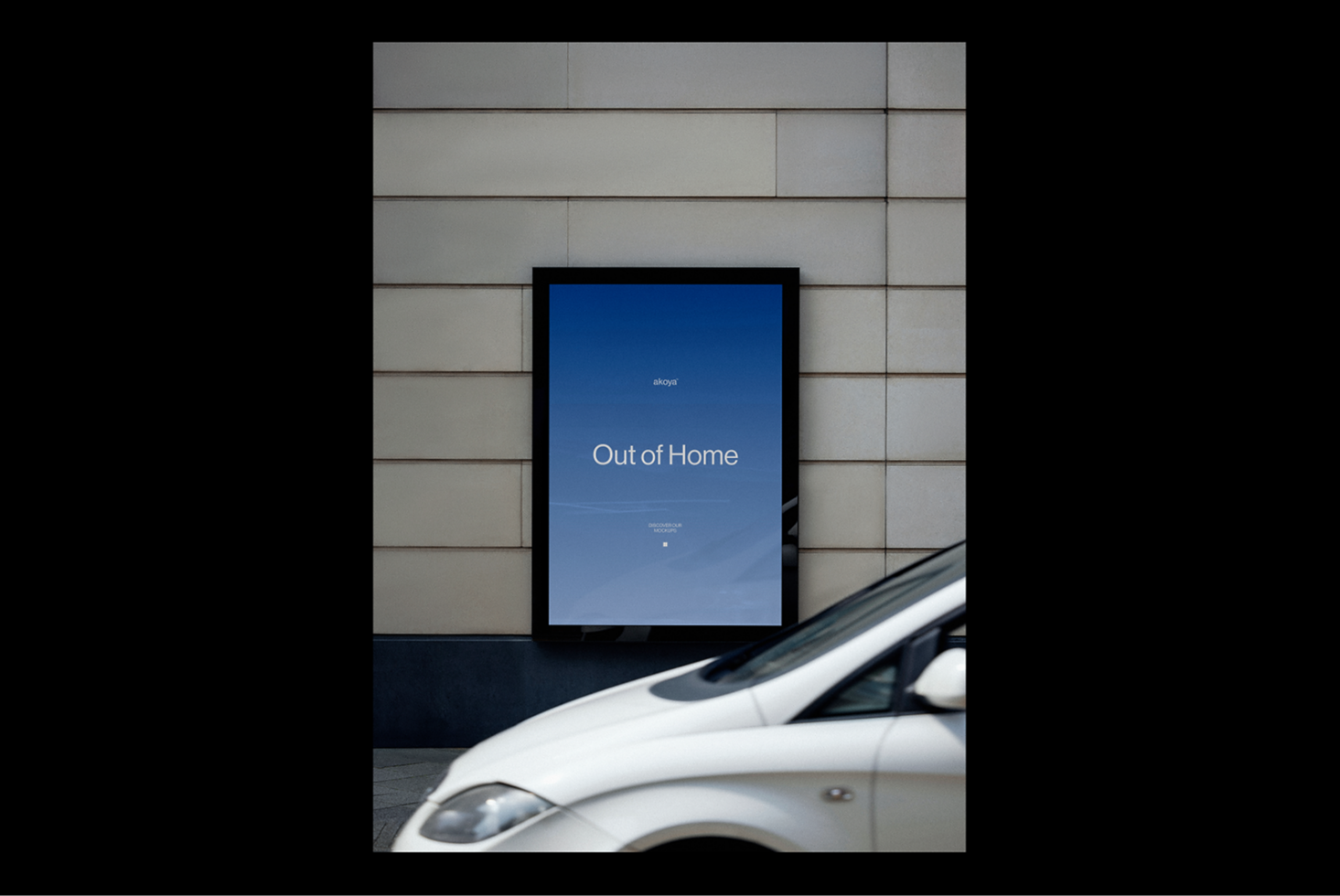 Outdoor ad mockup on urban wall with parked car in foreground ideal for showcasing promotional designs or graphics for designers and marketers