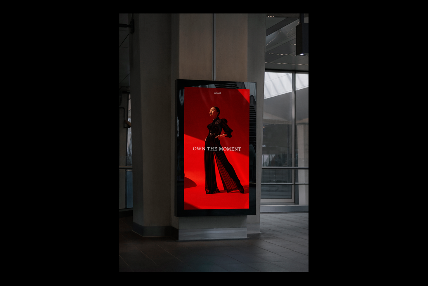 Digital poster mockup in urban setting showcasing fashion ad with model on red backdrop. Ideal for designers seeking high-quality display graphics.