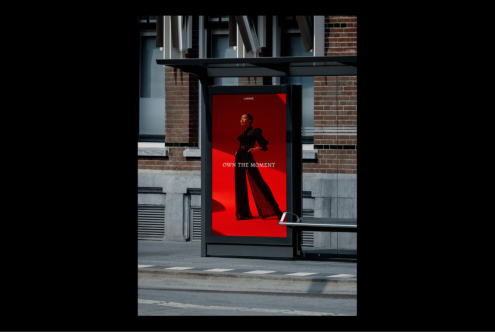 Bus stop advertising mockup featuring a fashion poster with bold red background. Keywords: digital assets, designers, mockups, advertising, templates.