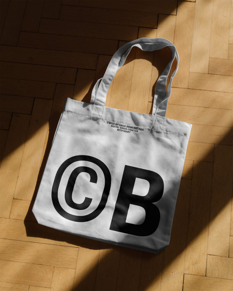 Tote bag mockup on wooden floor background with bold black CB print design. Ideal for branding presentations and graphic design projects.