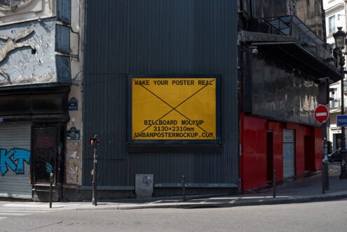Outdoor urban billboard mockup on grungy building wall in golden yellow with street scene