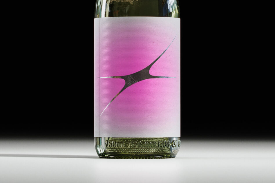 Wine bottle mockup with pink gradient label featuring abstract black shape