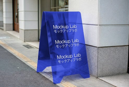 Blue A-frame sign mockup on city sidewalk for designers. Ideal for showcasing branding and signage designs. Keywords mockup template graphics.