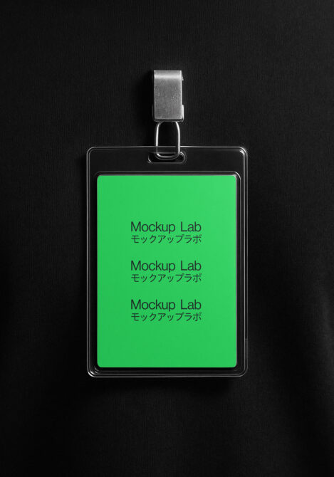 ID badge mockup hanging from metal clip showing neon green screen with repeating text, black backdrop