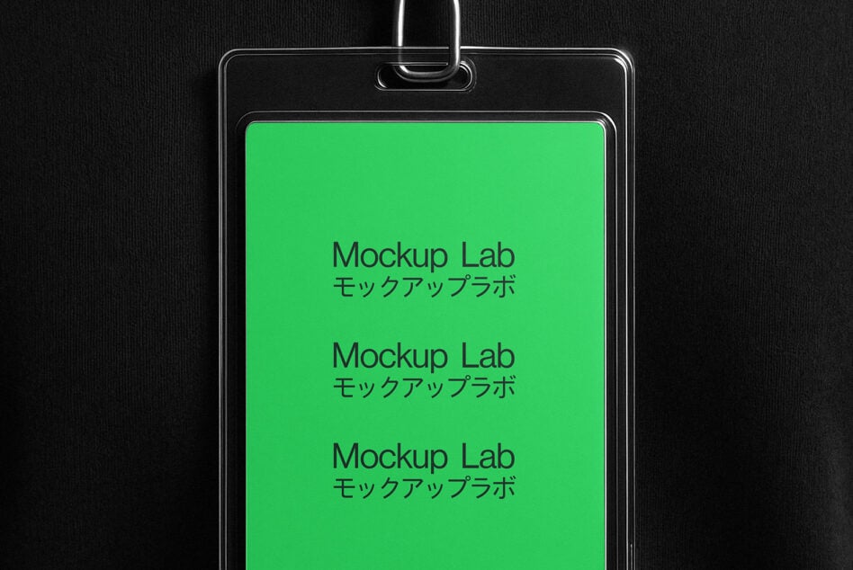 Plastic ID badge holder with bright green screen showing repeated text, hanging from metal chain