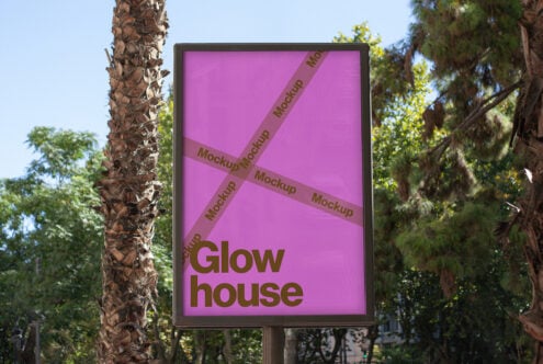 Outdoor vertical poster mockup with bold pink backdrop surrounded by trees ideal for advertising templates branding digital designers marketing