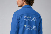 Blue denim jacket back showing white text print placement detail