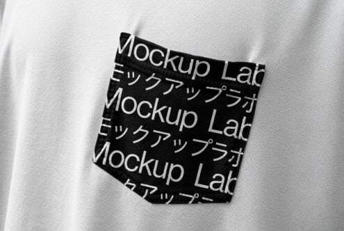 Close-up of white t-shirt with black pocket featuring modern typographic design Mockup Lab in English and Japanese. Ideal for fashion templates mockups.