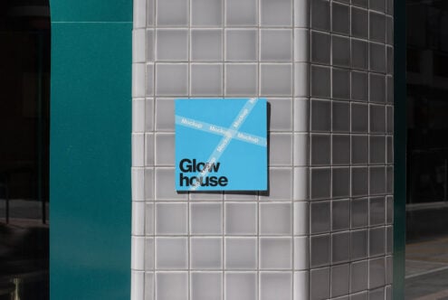 Mockup of a square blue poster with bold typography on a tiled wall, ideal for showcasing branding design, templates and creative graphics in urban settings.