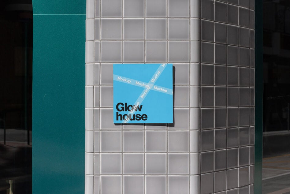 Bright blue business card mockup on white metro tiles with overlaid tape pattern