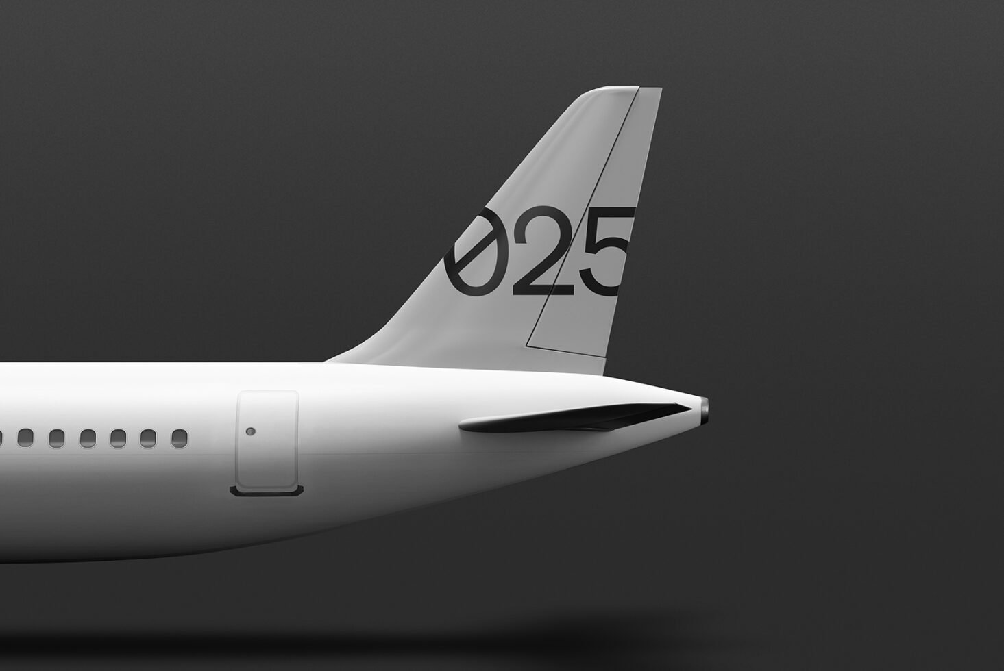 Airplane tail mockup on gray background showcasing minimalist design and bold typography. Ideal for graphic designers seeking high-quality aviation templates.