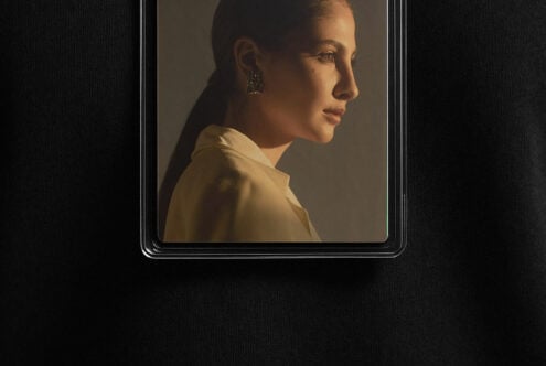 Profile of a woman in a side-lit portrait on a sleek black background perfect for mockups and design uses in professional graphic design projects.