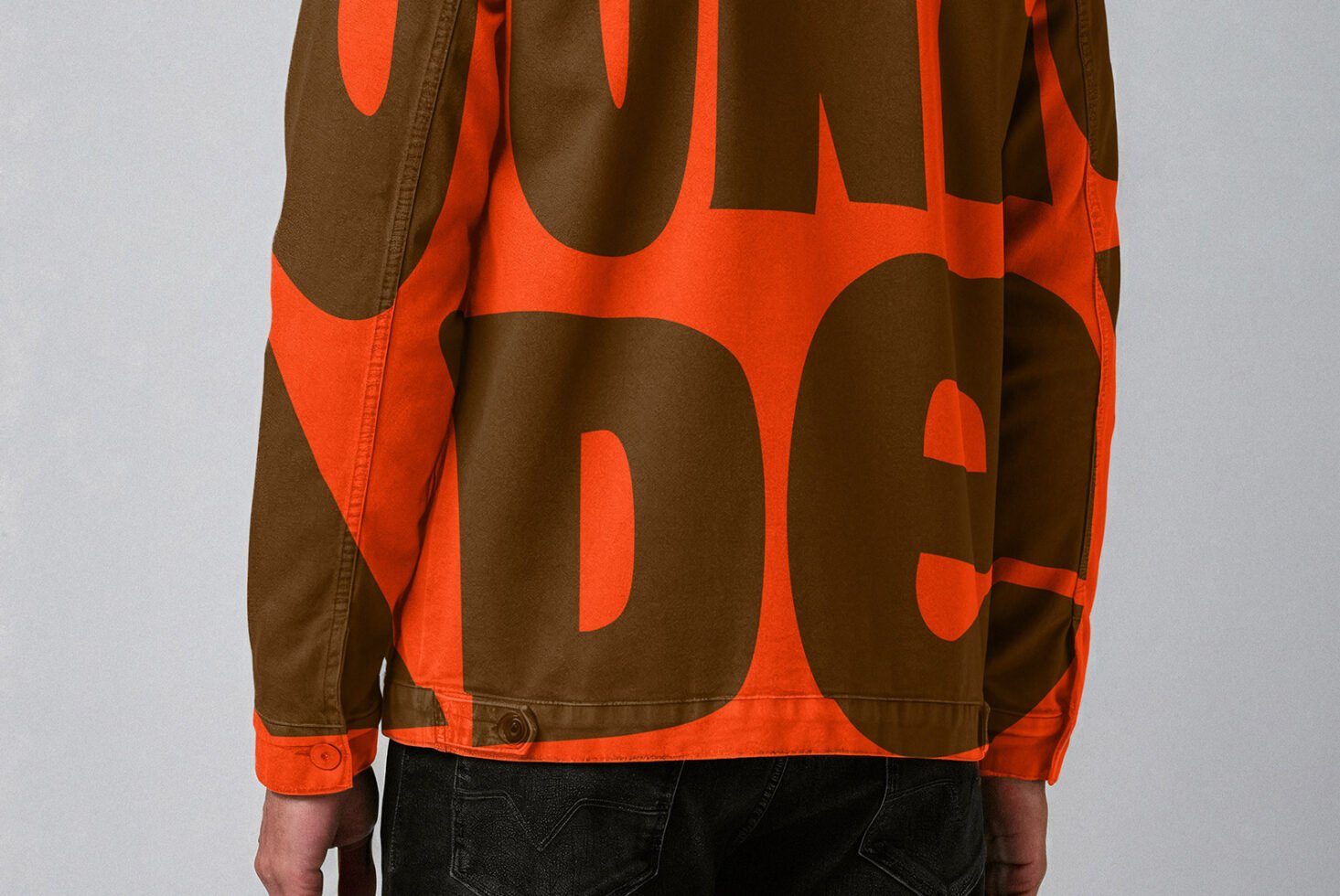 Back view of a jacket featuring bold orange and brown typography. Ideal for designers focusing on fashion graphics and modern design elements.