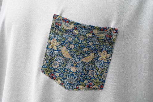 Floral bird pocket pattern design mockup on white fabric background. Ideal for designers seeking detailed textile graphics inspiration. High-quality texture.