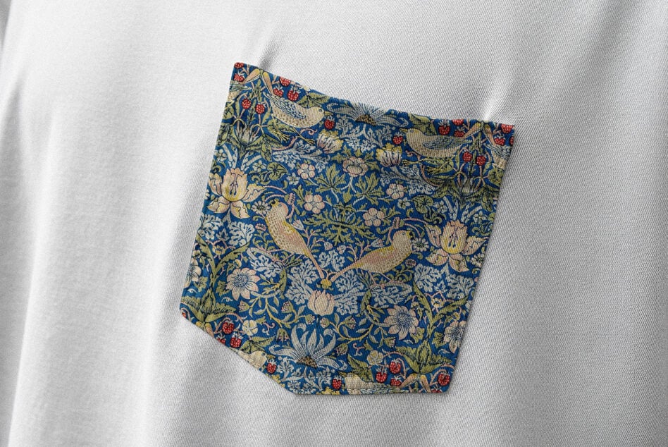 Blue floral patterned fabric swatch on white linen background mockup